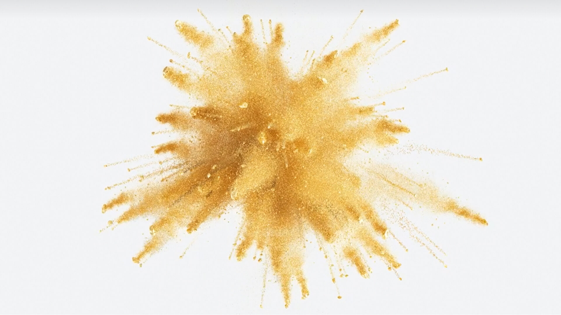 Goldpulver schießt in einem radialen Muster vor einem weißen Hintergrund hervor und fängt die dynamische Energie des Content-Marketings in einem einzigen, eindrucksvollen Bild ein.